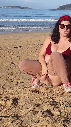 Woman Pissing on a Public Beach While No One Is There