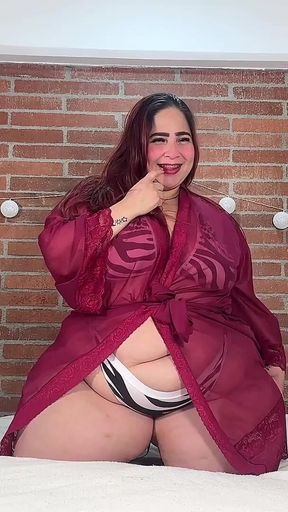 Plus-size Woman with Lush Curves in Zebra Lingerie: Provocative and Sensual in Bed