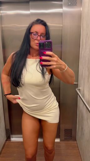 Female fitness model in elevator