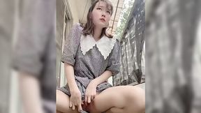 Japanese housewife jerks off pussy on a balcony - public solo