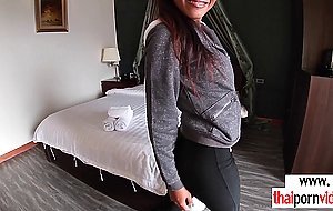 Petite inked amateur Thai teen Cherry testing the bed in a hotel