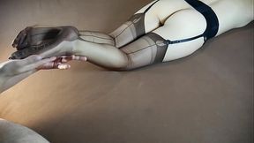 Sexy woman in long nylon socks gets her feet tickled and massaged