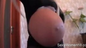 Hot petite pregnant camgirl with massive 52cm stomach gets off on camera!