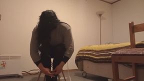 Sexy crossdresser in selfbondage chairtied
