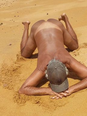 Ladysilva on all fours on the beach wanting cock in her ass