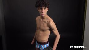 ”Curly twink boy shows off his slim body on webcam”