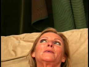 A mature blonde bombshell licks a cock and sucks cum in her mouth