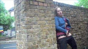 Ashley Riders, the daring British hottie, flashes her alluring boobs in a public park