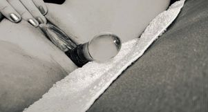 She lets the glass smack