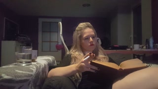 reading a book and smoking cigarette