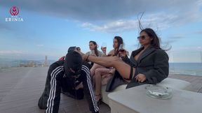 The three Mistresses humiliate the slave on the rooftop