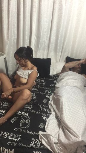 sexy brunette masturbates next to her stepfather in her room.