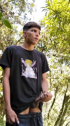 Young Latino releases his milk stream outdoors