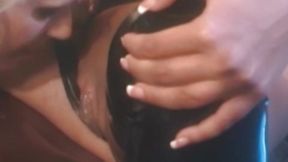 Blonde beauty in latex suit gets fingered and rimmed