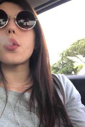 Petra smoking in car