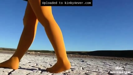 Barefoot Walking By Dried Up Lake In Yellow Pantyhose