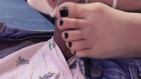 Ebony babe gives footjob in the car