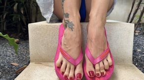 Pink flip flops on my pretty feet with long toes in Outdoor, red toenails polish