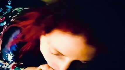 Redhead milf on her knees sucking cock and takes the cum in her mouth and continues to suck his cock with a load in her mouth