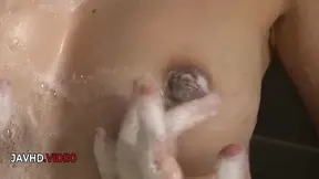 Japanese cutie Manami gives a steamy bathtub blowjob