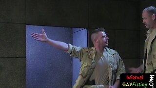 Military hunk spit roasted in 3some