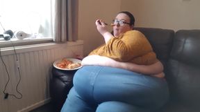 SSBBW huge belly whilst eating on sofa