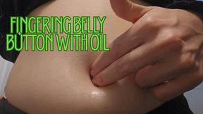 Fingering my belly button with oil, two fingers on it