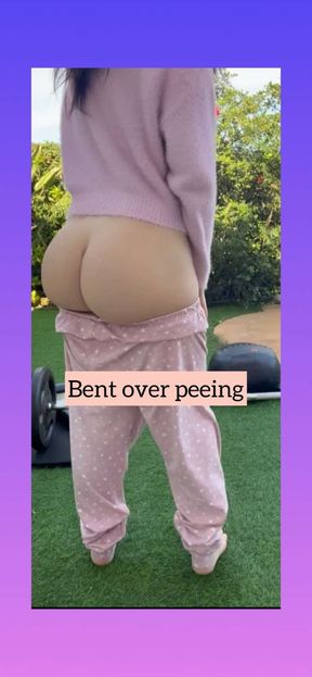 Bent over peeing