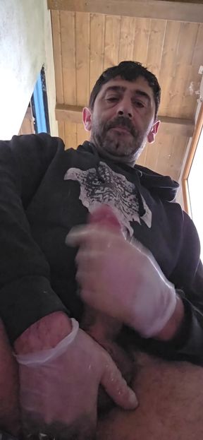 Straight boy jerks off on the construction site with latex gloves.   Clip 1
