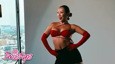 Asian beauty Nicole Doshi strikes sensual poses during a behind-the-scenes photoshoot before touching herself