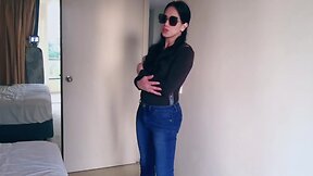 Stunning asian ladyboy shows off her gifted big boobs in a sexy jeans striptease