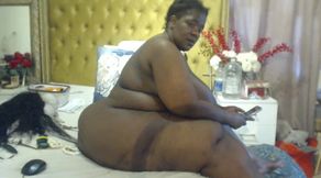 Black SSBBW Masturbating and Stripteasing