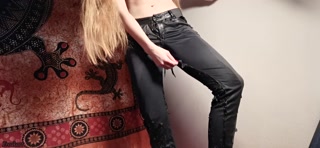 Topless beauty pisses through her ruined leather trousers