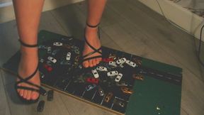 Giantess goddess WinnieLouxo Crushes 60 tiny cars in black block heels with painted toenails right close view