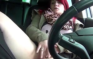 Chunky redhead fingering herself in the car