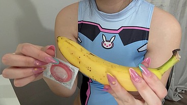 My stepsister puts a condom on the banana, plays with it, then sticks it in a fake pussy babe