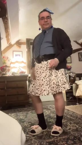 Dressed with a shirt and tie and a skirt with feminine underwear for a night out