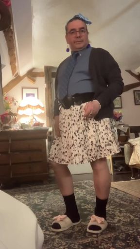Dressed with a shirt and tie and a skirt with feminine underwear for a night out
