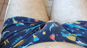Masturbating outside lying on a plastic bed