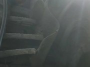 Shaved hunk in gumboots sits down and works out a hot load on tractor steps