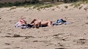 intimate view of a bare vulva on a secluded beach