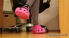 Under Desk Foot Play - Pink Clogs and Worn Socks