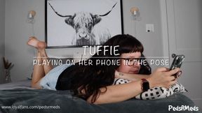 Tuffie Playing on Her Phone in the Pose