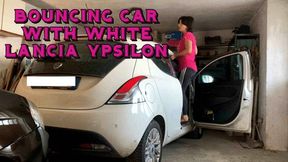 car bouncing with new white Lancia ypsilon car