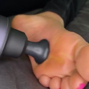 Ebony Girl Gives Her Feet a Massage with a Massage Gun