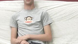 On a couch by himself cute gay man Danny jerks off his dick