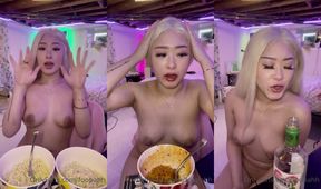 Asian beauty's daring noodle challenge captivates with petite fiery charm