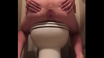 showing ass in a public bathroom