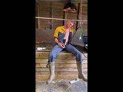 Farmer smokes and milks himself on a break