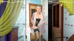 Charming Middle-aged Lukerya Warms up with a Cheerful Smile During the Webcam Broadcast.